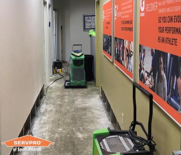drying water damaged office space hallway