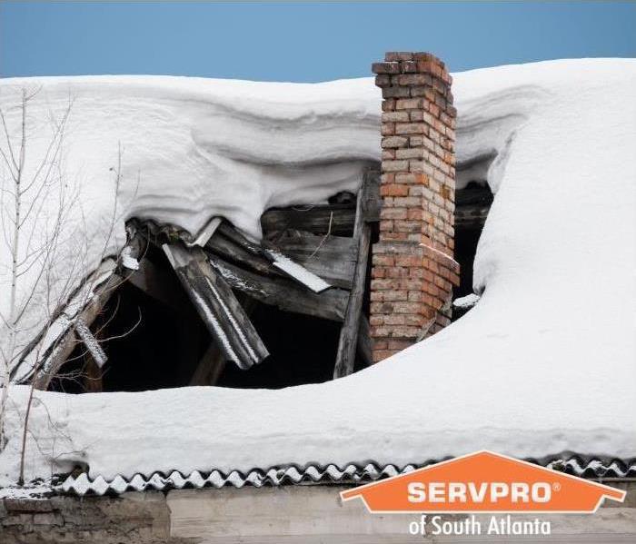 Collapsed roof under heavy snow