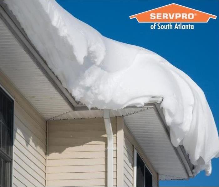 img src =”roof with snow.jpg” alt = "snow overflowing off roof” >